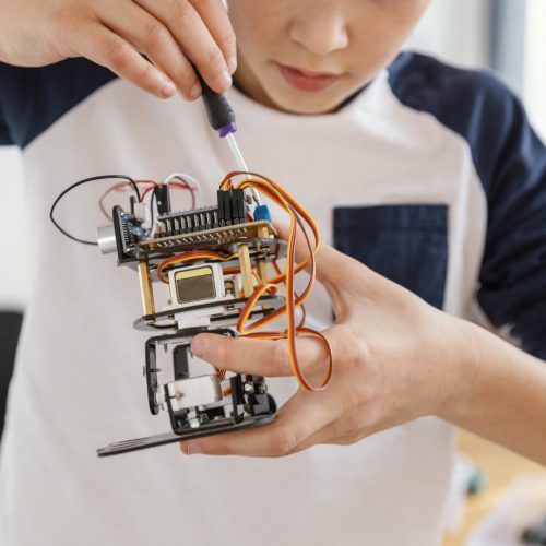 close-up-child-making-robots